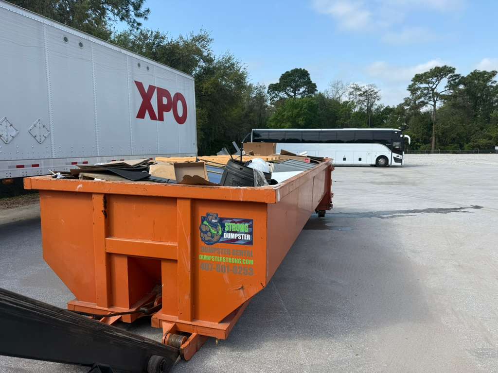 Dumpster Strong roll-off loaded with mixed construction debris ready for landfill transport. Photo courtesy of Dumpster Strong.