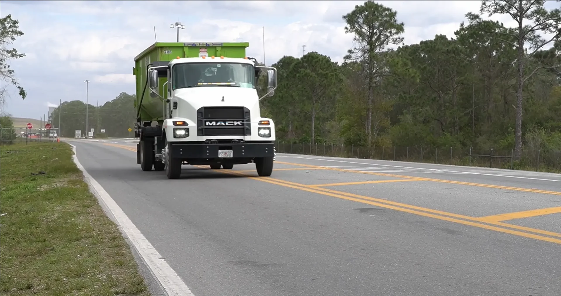 Dumpster truck on highway